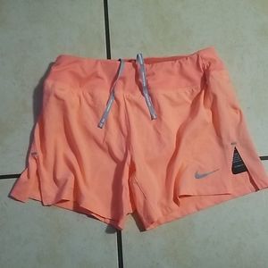Pink Nike running shorts